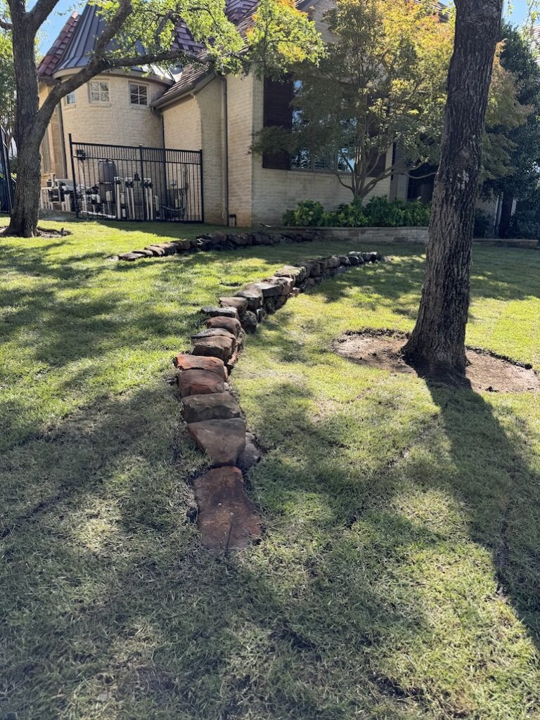 Mossy Boulder Retaining Wall as Drainage and Erosion Solution