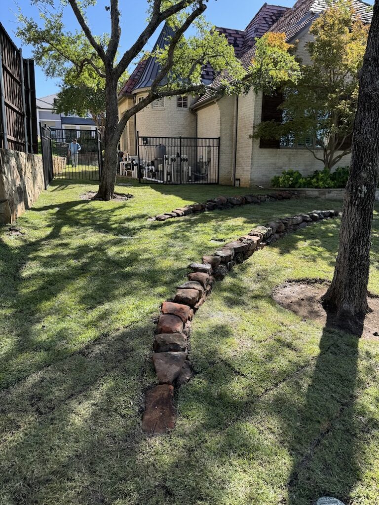 Mossy Boulder Retaining Wall as Drainage and Erosion Solution