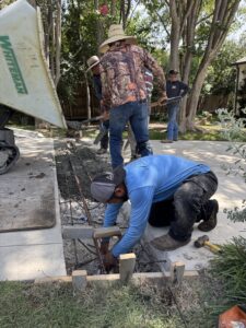 Dallas Drainage Pros working with other trades on construction job