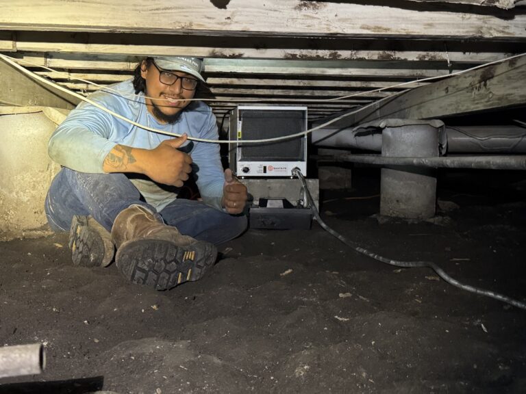 Dehumidifier installed in vented crawl space to mitigate moisture