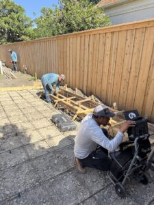 Dallas Drainage Pros Inspecting drainage system on large new home construction project